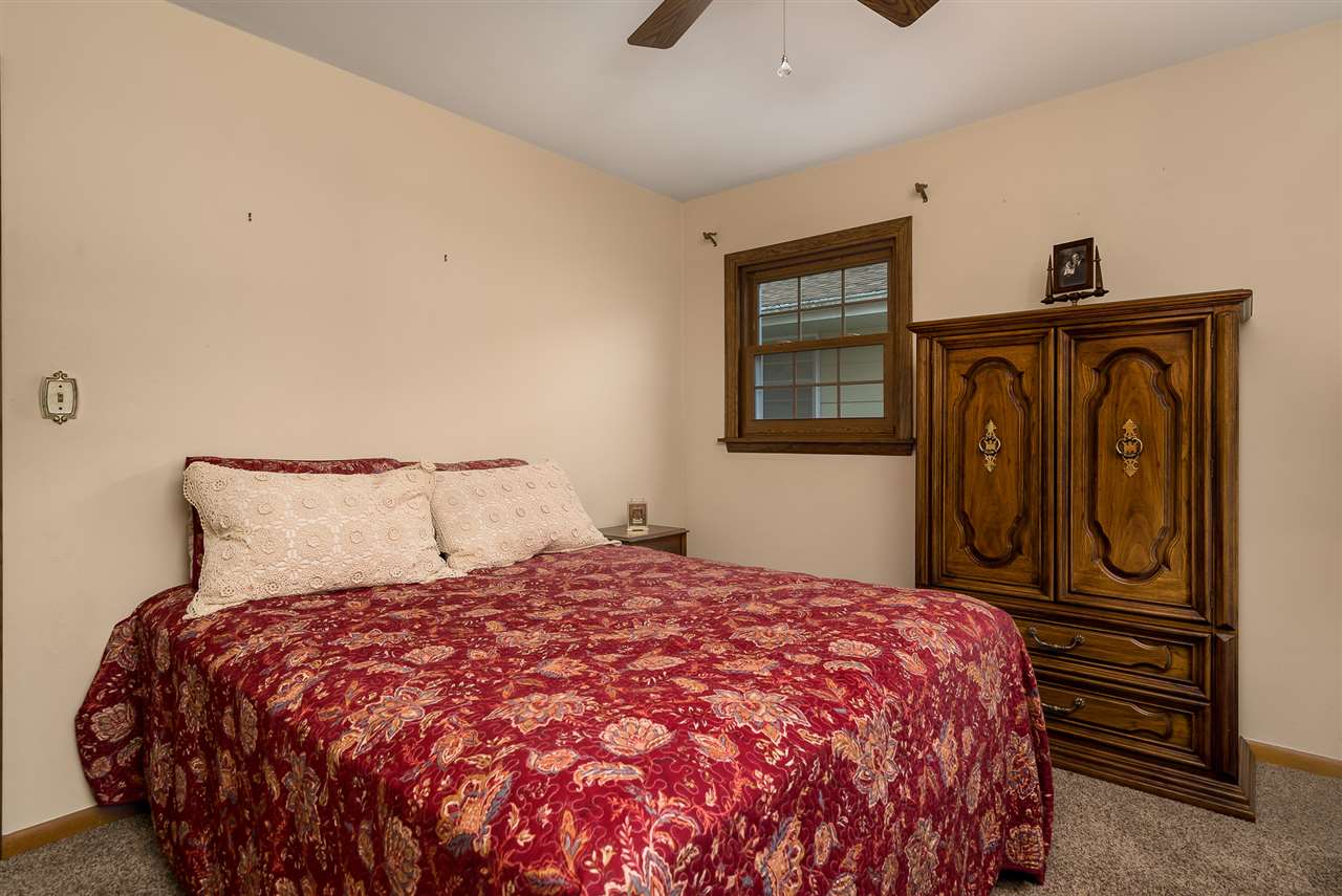 1104 Brookfield Road Rockford, IL 61107 - Photo 14 of 22 a bedroom with a bed and a dresser