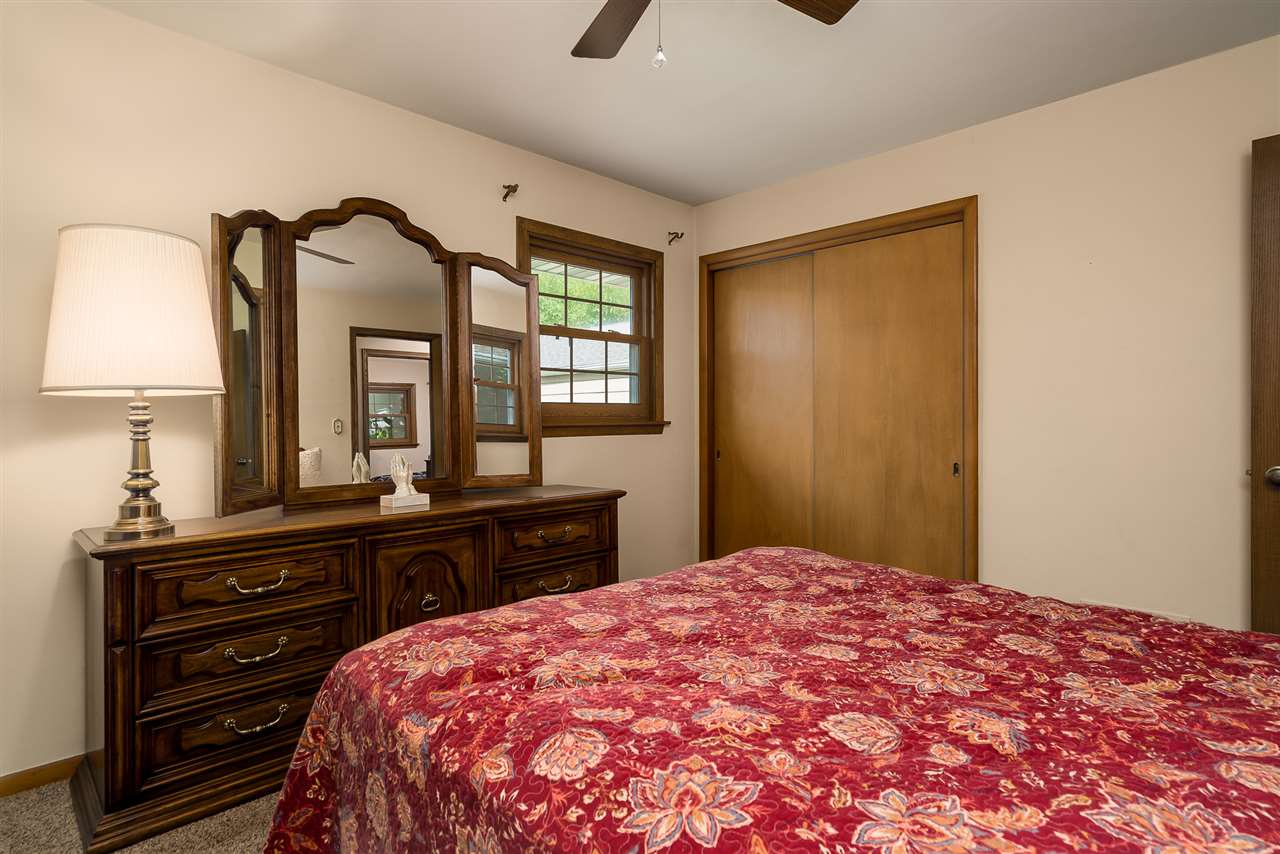 1104 Brookfield Road Rockford, IL 61107 - Photo 15 of 22 a bedroom with a bed and a dresser