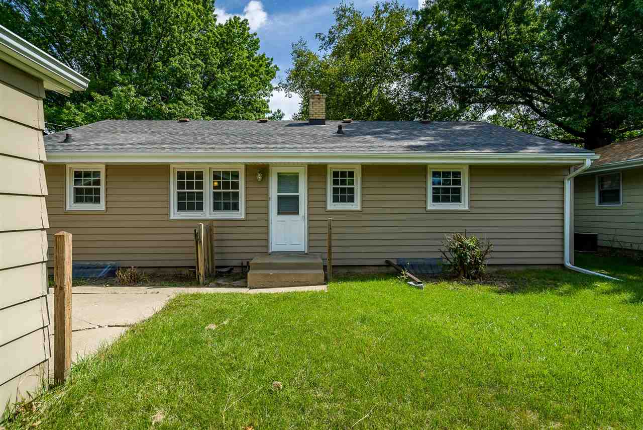 1104 Brookfield Road Rockford, IL 61107 - Photo 20 of 22 a view of an house with backyard space and garden