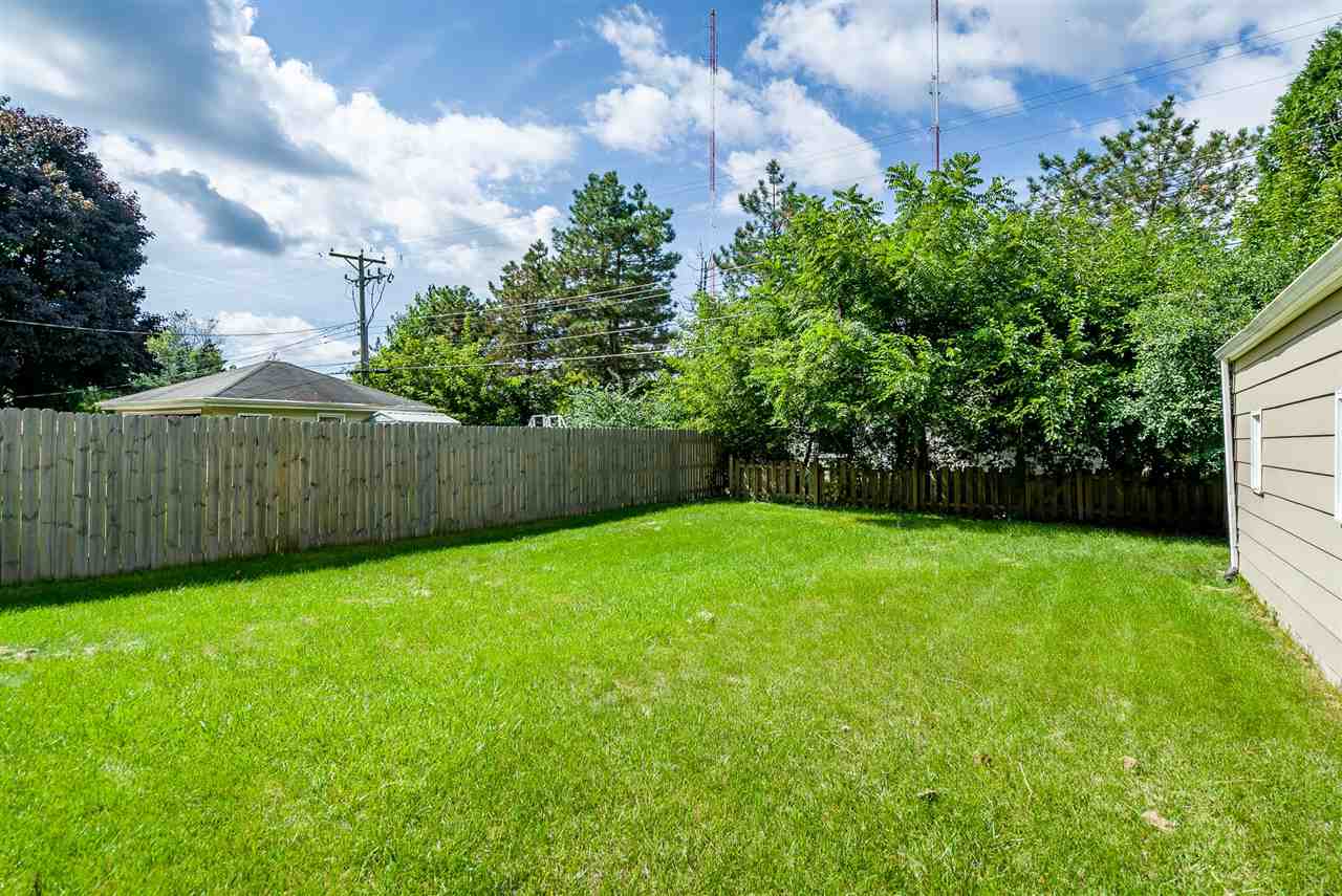 1104 Brookfield Road Rockford, IL 61107 - Photo 21 of 22 a view of a backyard with a trampoline