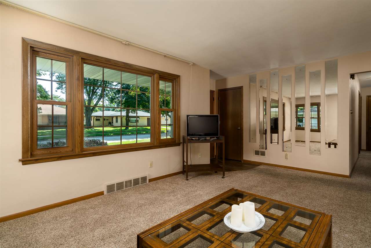 1104 Brookfield Road Rockford, IL 61107 - Photo 5 of 22 a living room with furniture and a window
