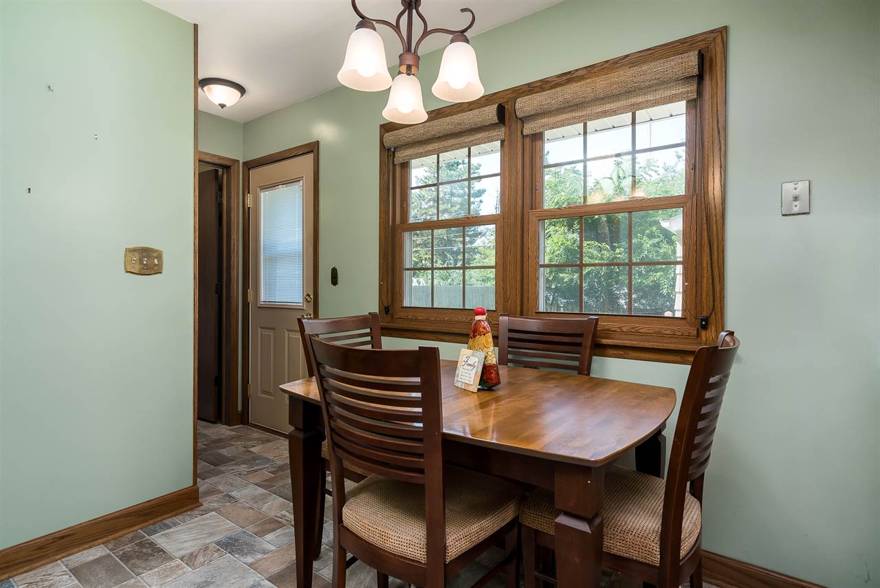 1104 Brookfield Road Rockford, IL 61107 - Photo 7 of 22 a dining room with furniture and window