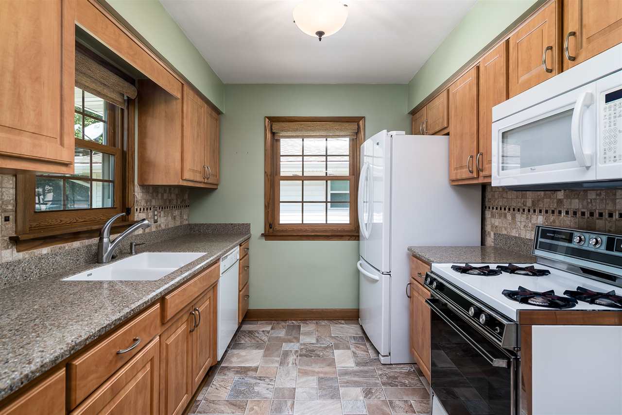 1104 Brookfield Road Rockford, IL 61107 - Photo 9 of 22 a kitchen that has a sink and a stove