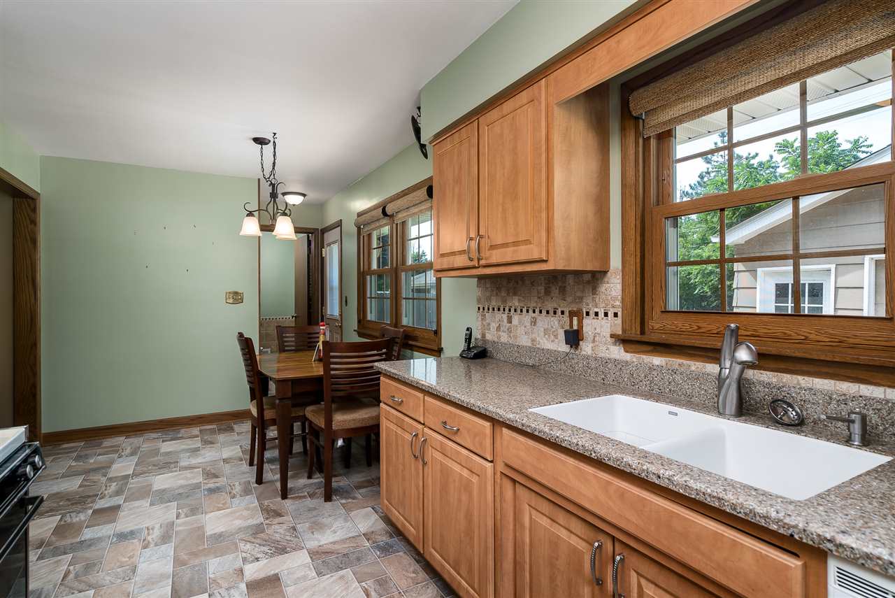 1104 Brookfield Road Rockford, IL 61107 - Photo 10 of 22 a kitchen with granite countertop sink stove and cabinets