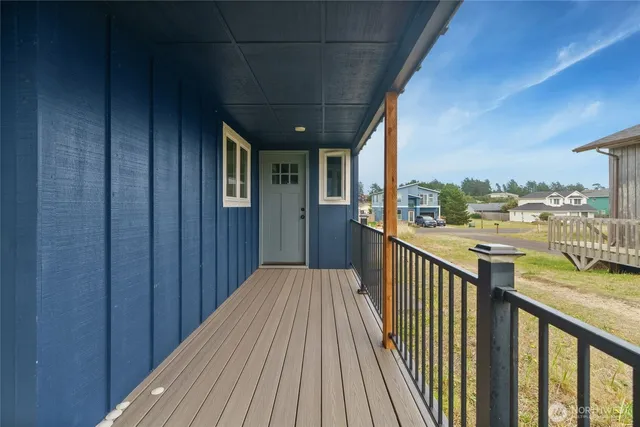 a view of a balcony with wooden floor