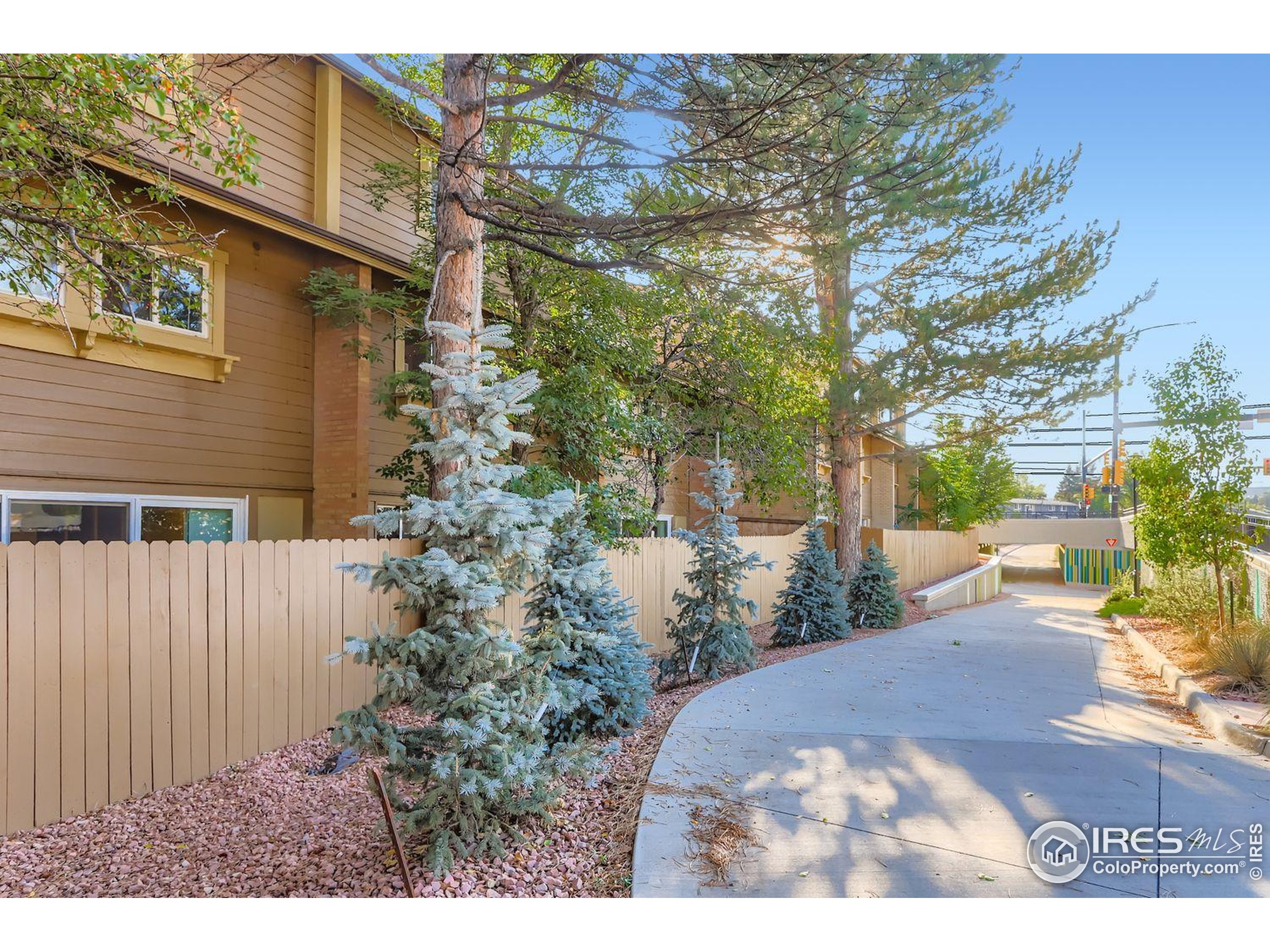 3000 Colorado Avenue, Unit B206 Boulder, CO 80303 - Photo 18 of 23 a view of a backyard with plants and a patio