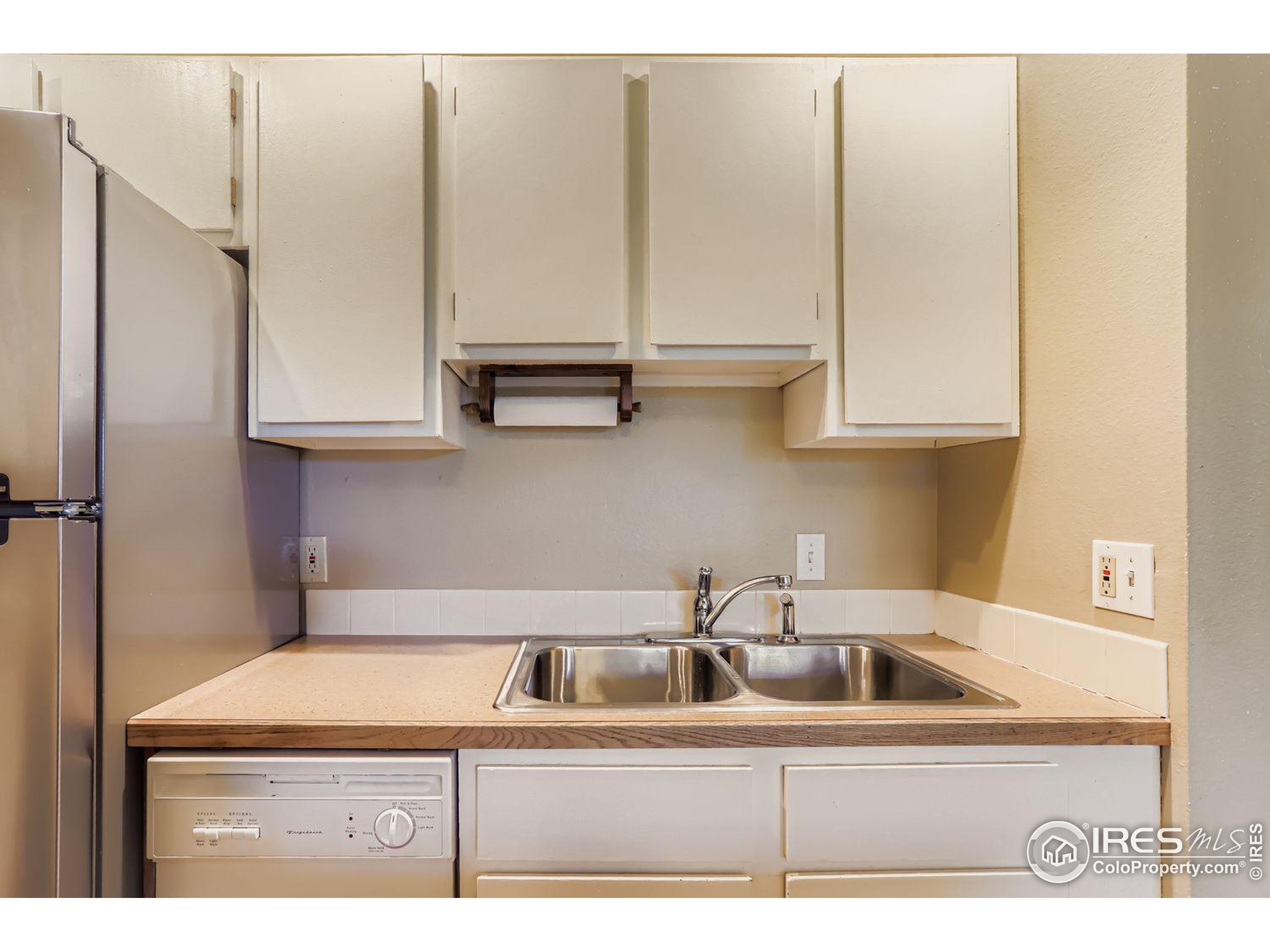 3000 Colorado Avenue, Unit B206 Boulder, CO 80303 - Photo 5 of 23 a kitchen with stainless steel appliances granite countertop a sink a refrigerator and a grey cabinets