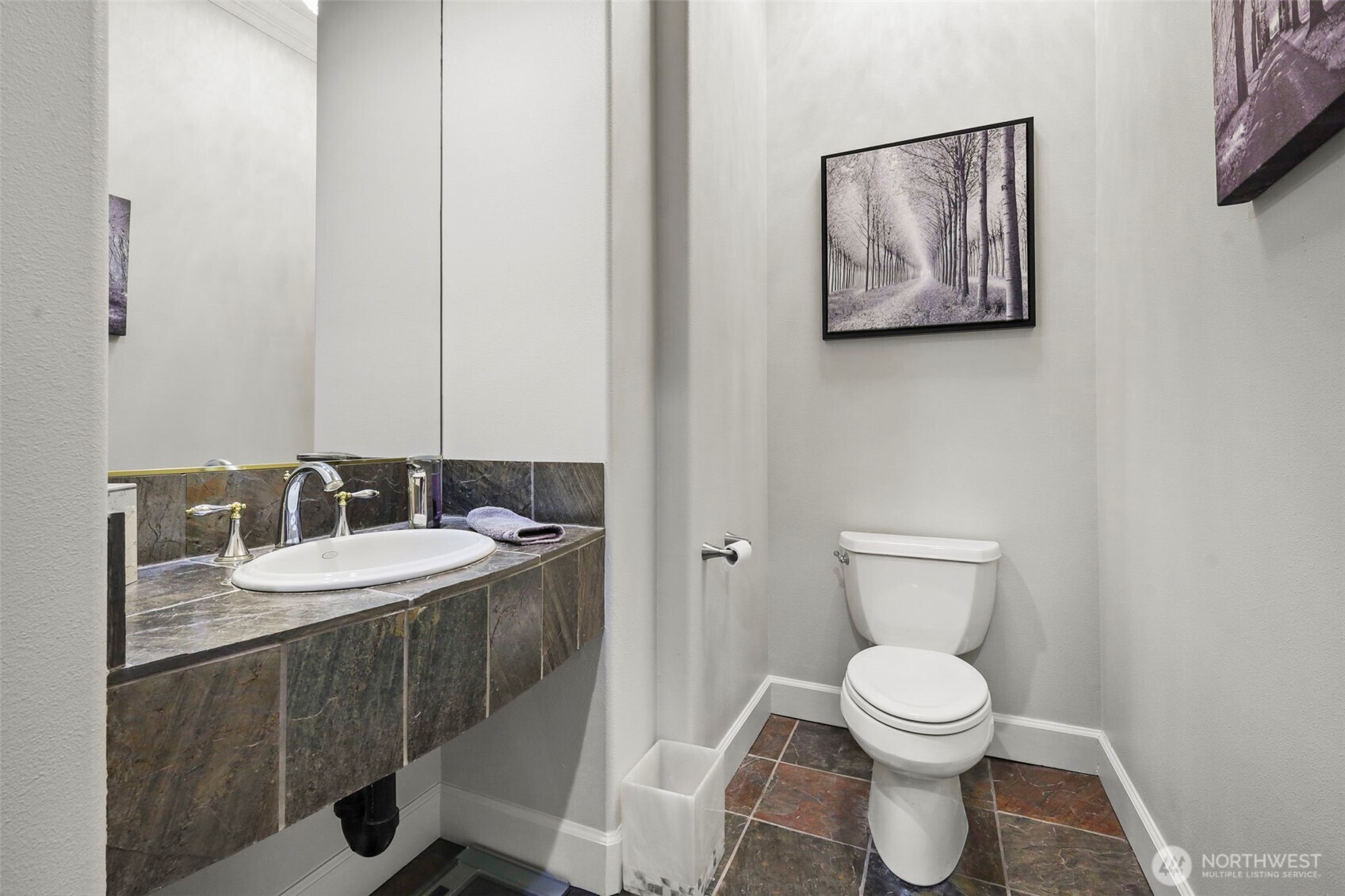 13612 231st Street East Graham, WA 98338 - Photo 13 of 40 a bathroom with a toilet a sink and mirror