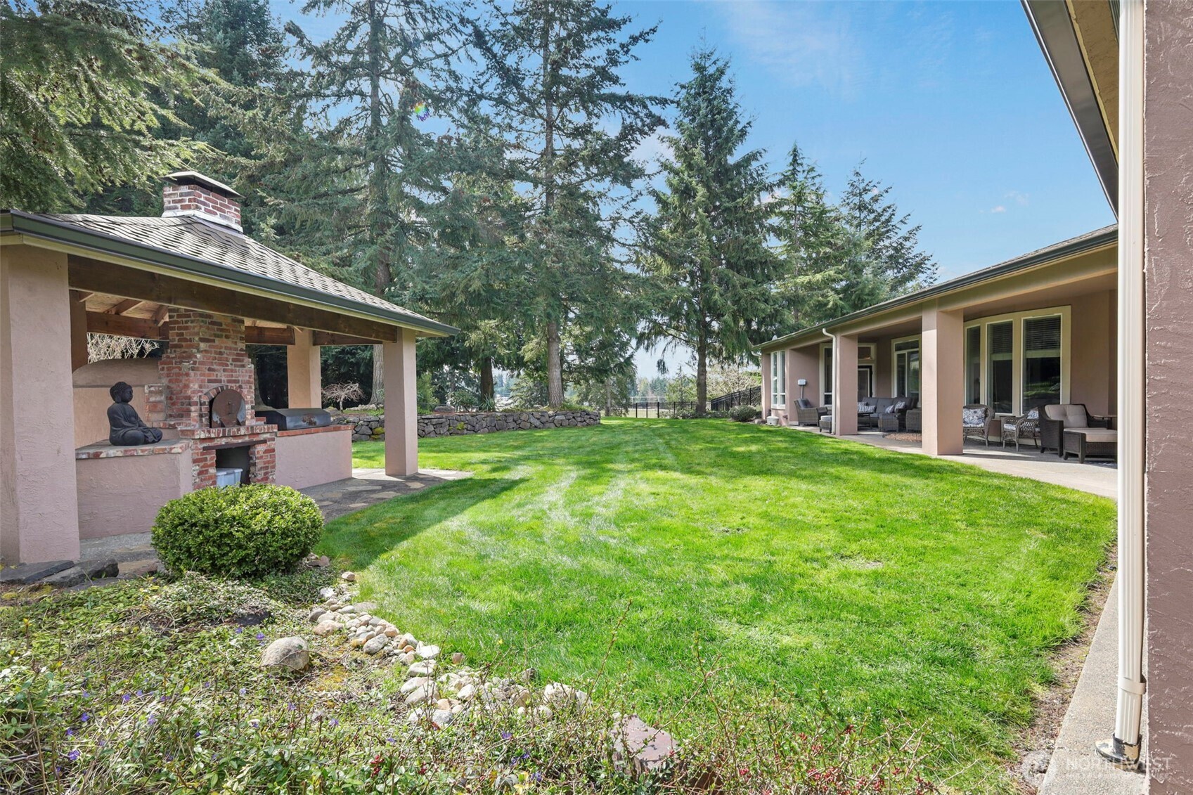 13612 231st Street East Graham, WA 98338 - Photo 21 of 40 a view of a house with backyard porch and sitting area