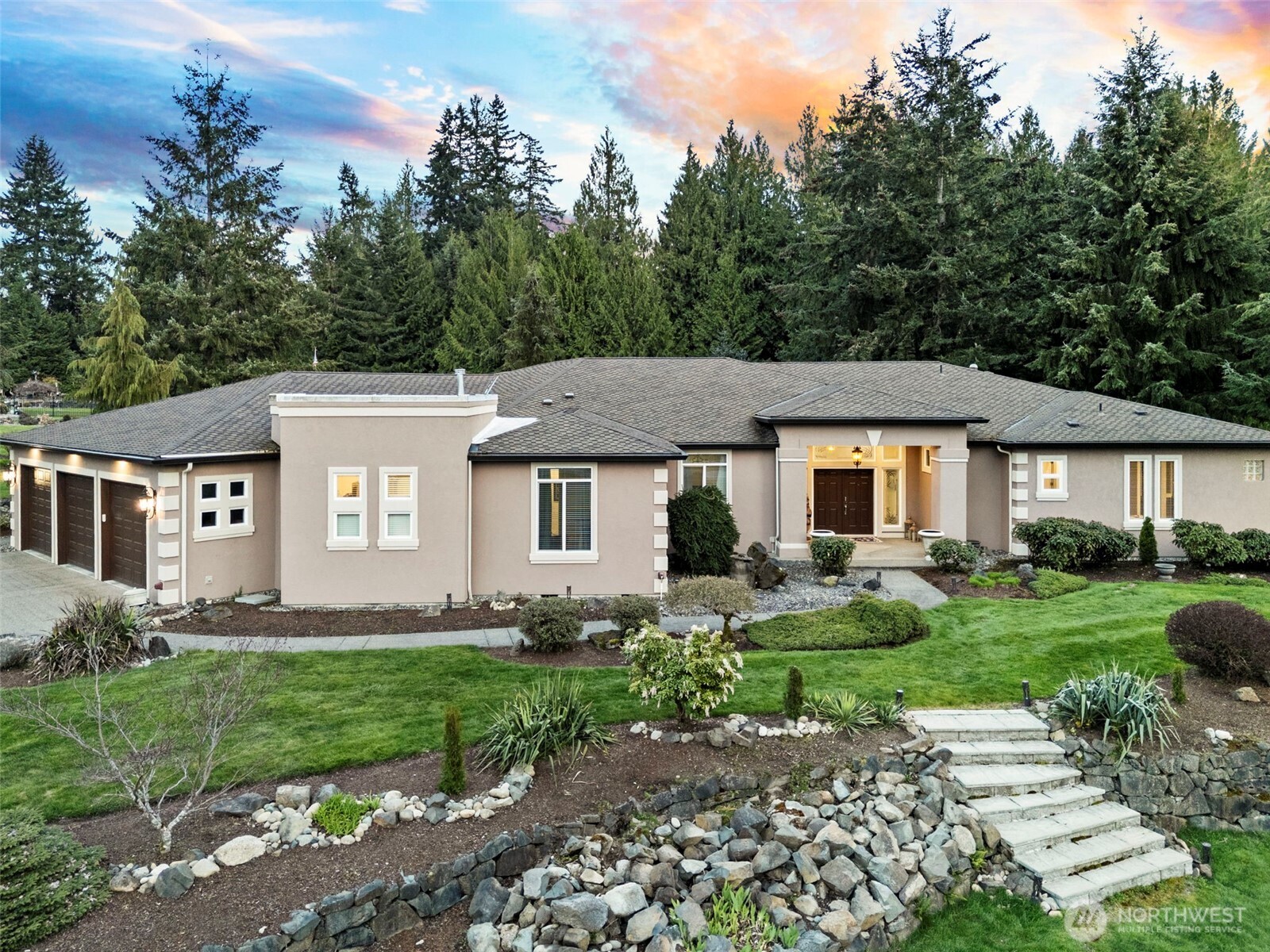 13612 231st Street East Graham, WA 98338 - Photo 25 of 40 a front view of a house with a yard and trees