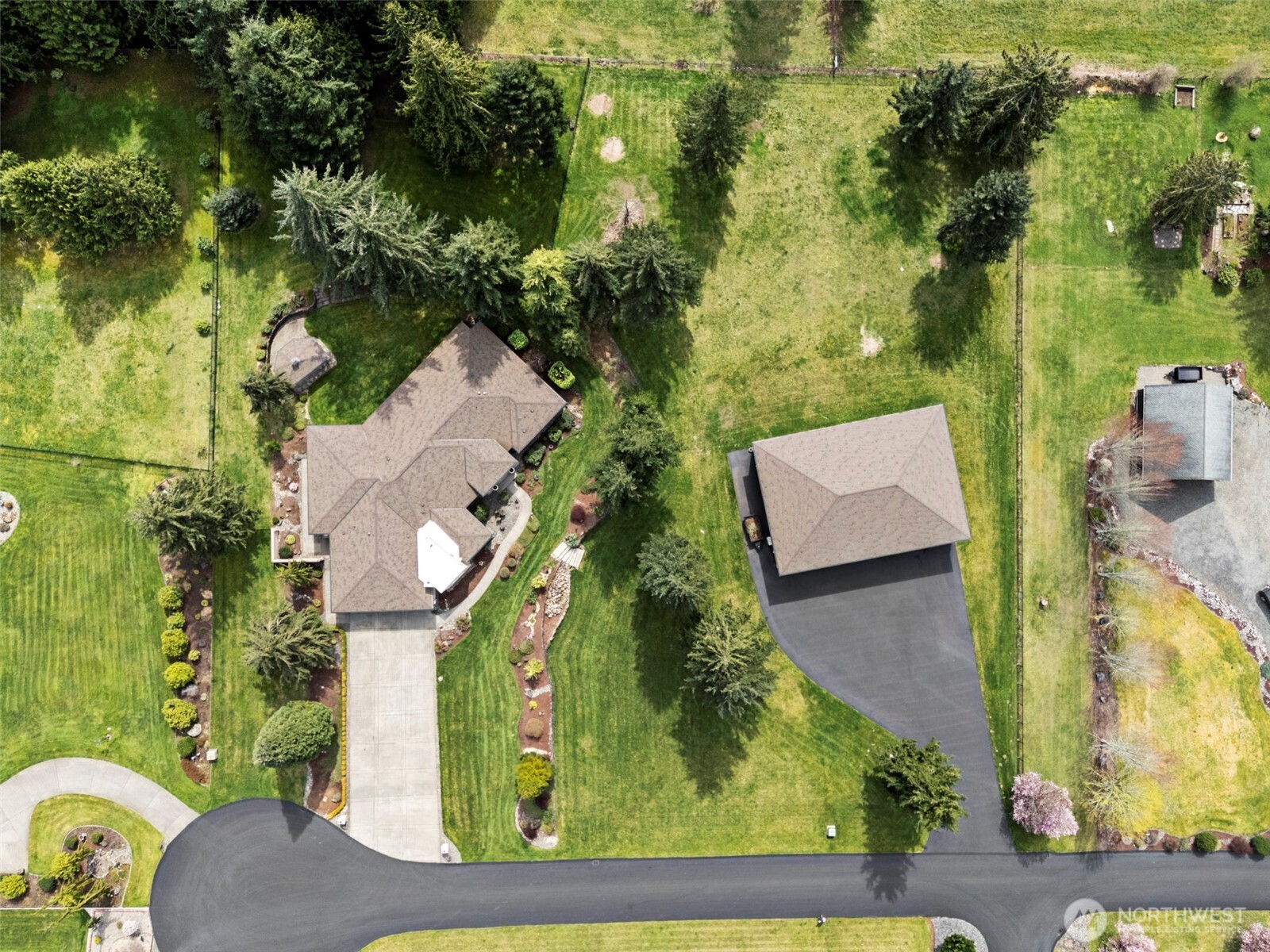 13612 231st Street East Graham, WA 98338 - Photo 34 of 40 an aerial view of a house with a yard basket ball court and outdoor seating