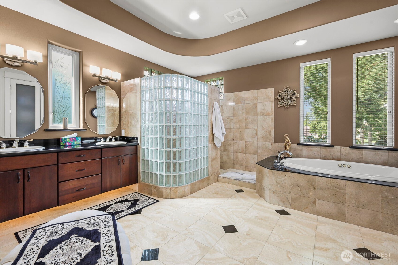 13612 231st Street East Graham, WA 98338 - Photo 7 of 40 a spacious bathroom with a tub sink shower and mirror