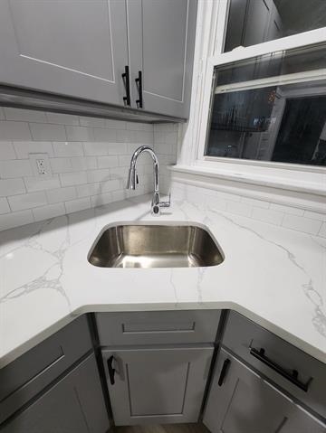 65 Halstead Street, Unit 1 Kearny, NJ 07032 - Photo 6 of 15 a close view of sink and washing machine