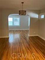 a view of a livingroom with wooden floor