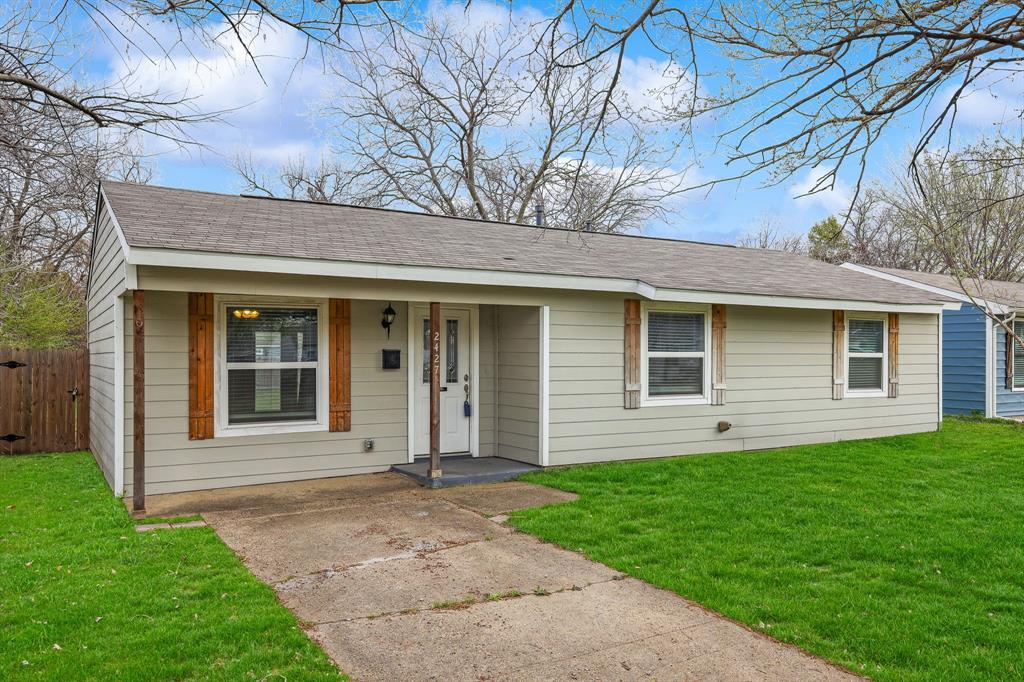 2427 Hillglenn Road Dallas, TX 75228 - Photo 1 of 1 front view of a house with a yard
