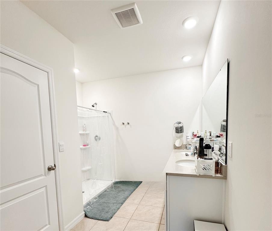 1122 Brimstone Circle Winter Haven, FL 33884 - Photo 12 of 17 a bathroom with a sink and mirror