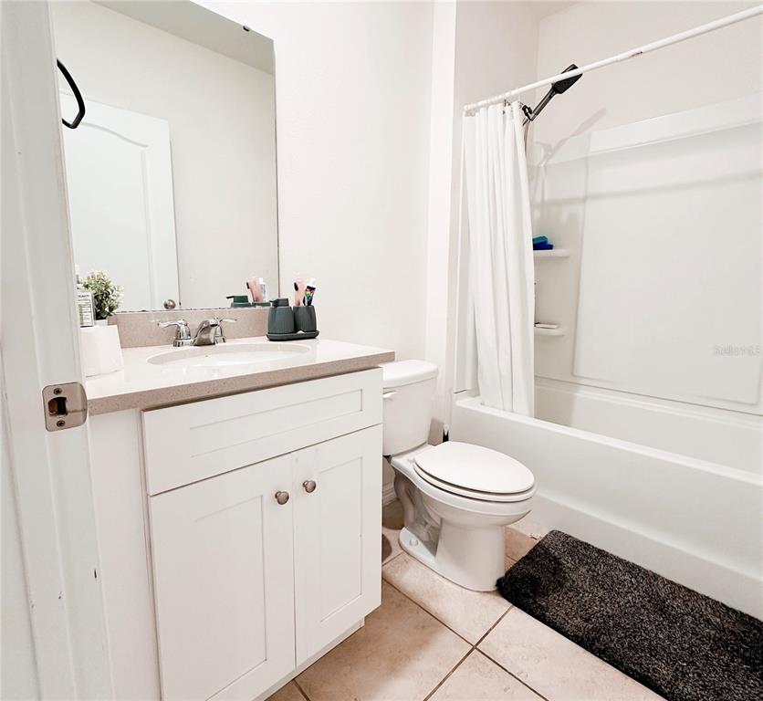 1122 Brimstone Circle Winter Haven, FL 33884 - Photo 13 of 17 a bathroom with a sink toilet and shower
