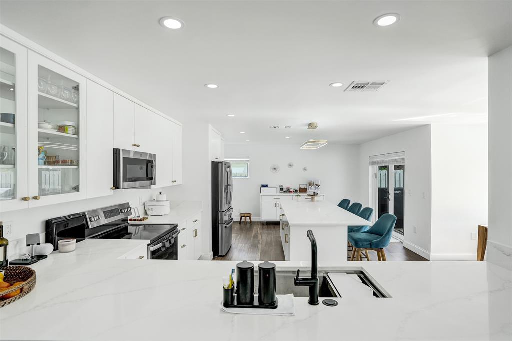 930 Greenbriar Avenue Davie, FL 33325 - Photo 19 of 28 a room with lots of furniture and mirrors