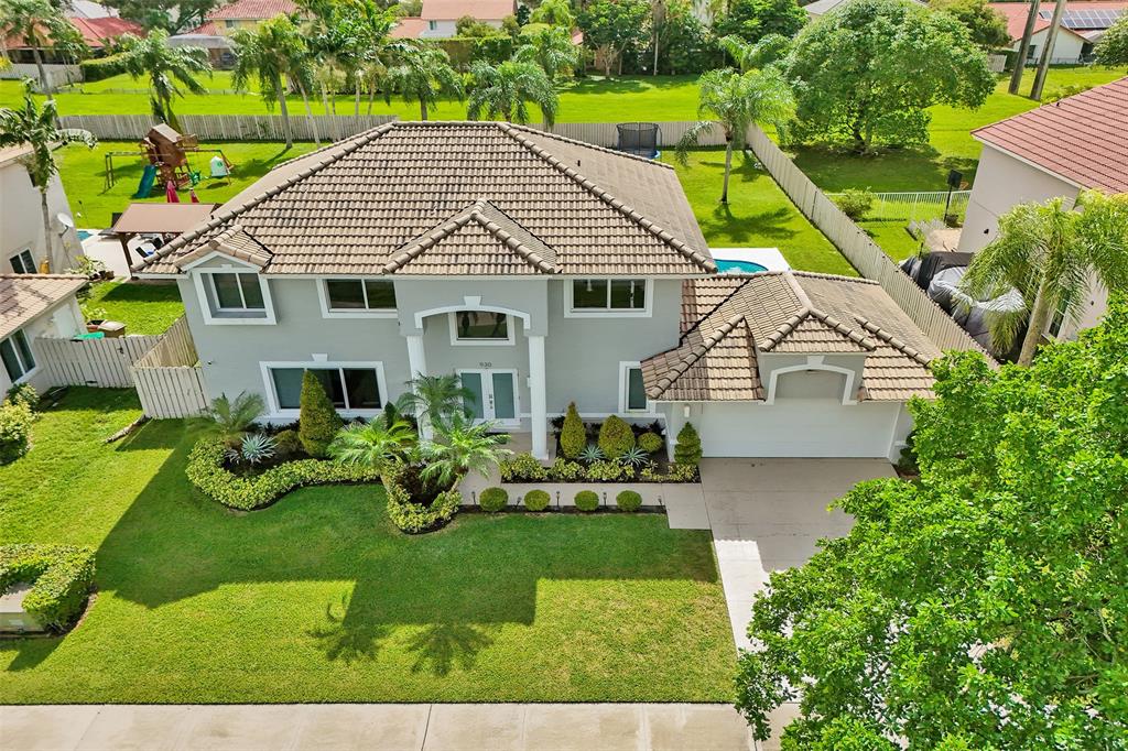 930 Greenbriar Avenue Davie, FL 33325 - Photo 21 of 28 a aerial view of a house with yard and green space