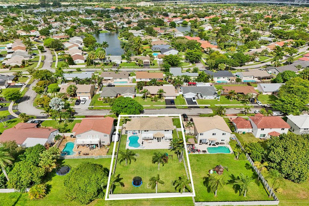 930 Greenbriar Avenue Davie, FL 33325 - Photo 27 of 28 an aerial view of residential houses with outdoor space and street view