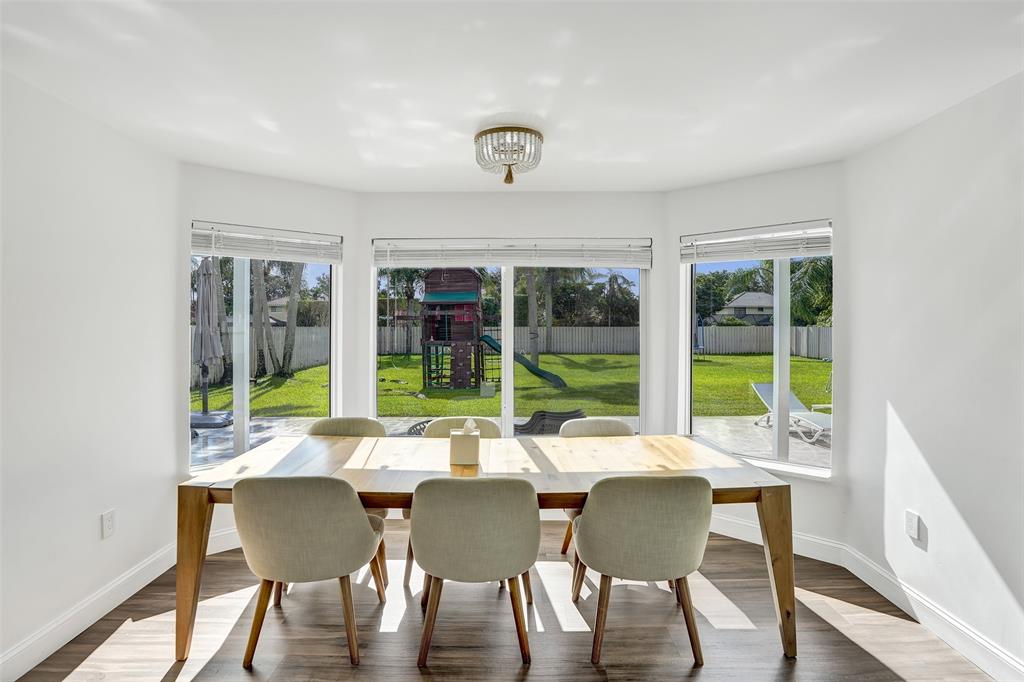 930 Greenbriar Avenue Davie, FL 33325 - Photo 9 of 28 a view of a dining room with furniture window and outside view
