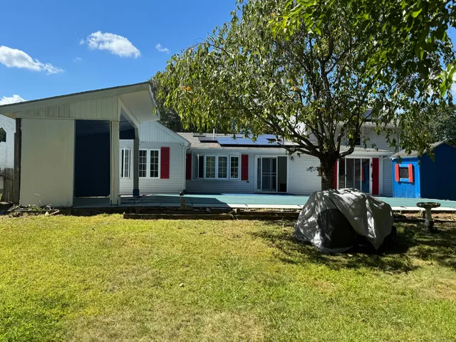 a view of swimming pool with a yard