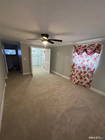 a kitchen with stainless steel appliances granite countertop a stove cabinets and living room view