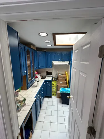 a kitchen with a sink and appliances