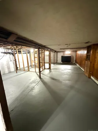 a view of an empty room with a fireplace