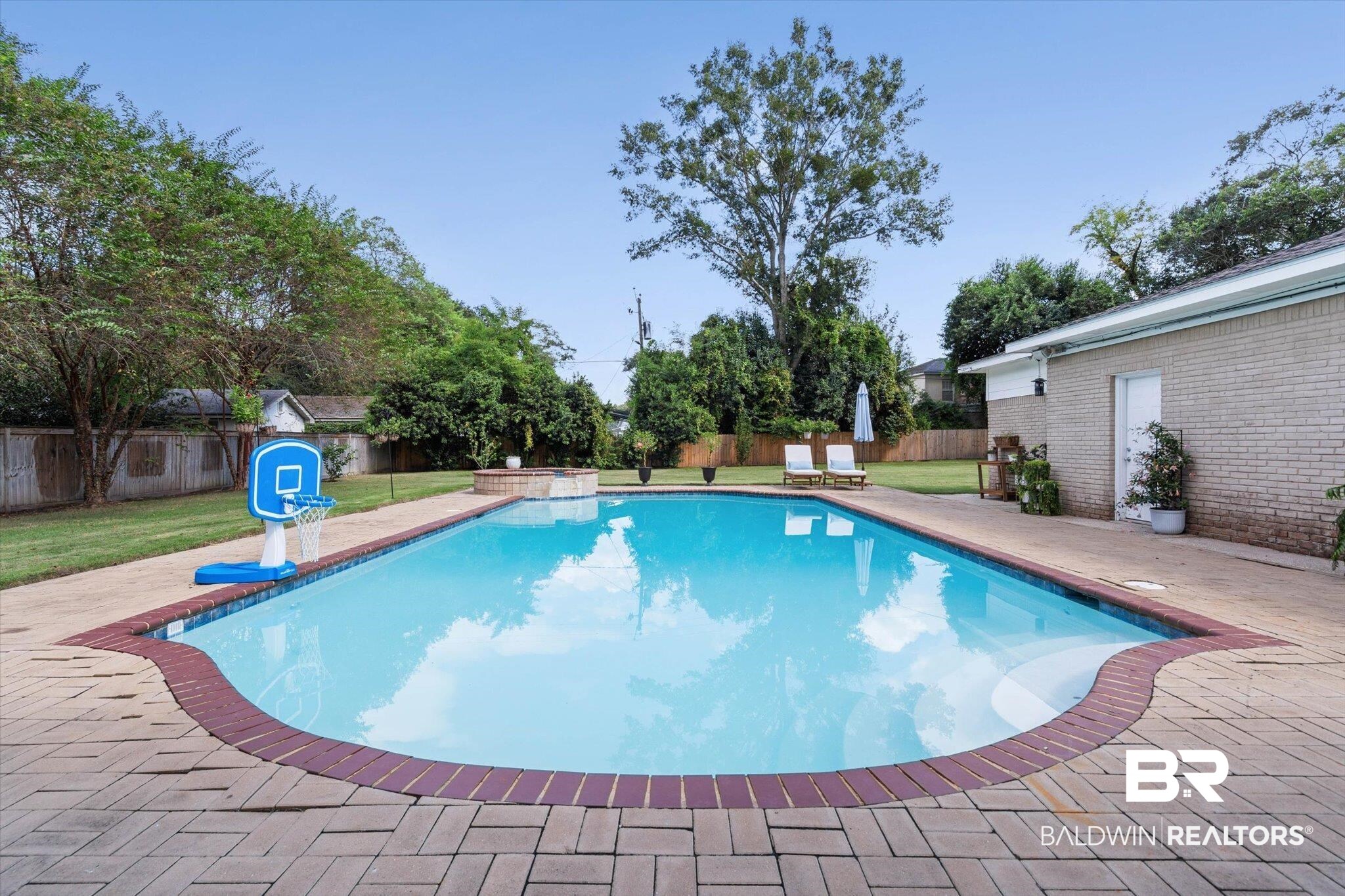 254 Woodlands Avenue Mobile, AL 36607 - Photo 33 of 50 View of pool with a fenced backyard and a patio