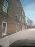a view of a brick wall of building