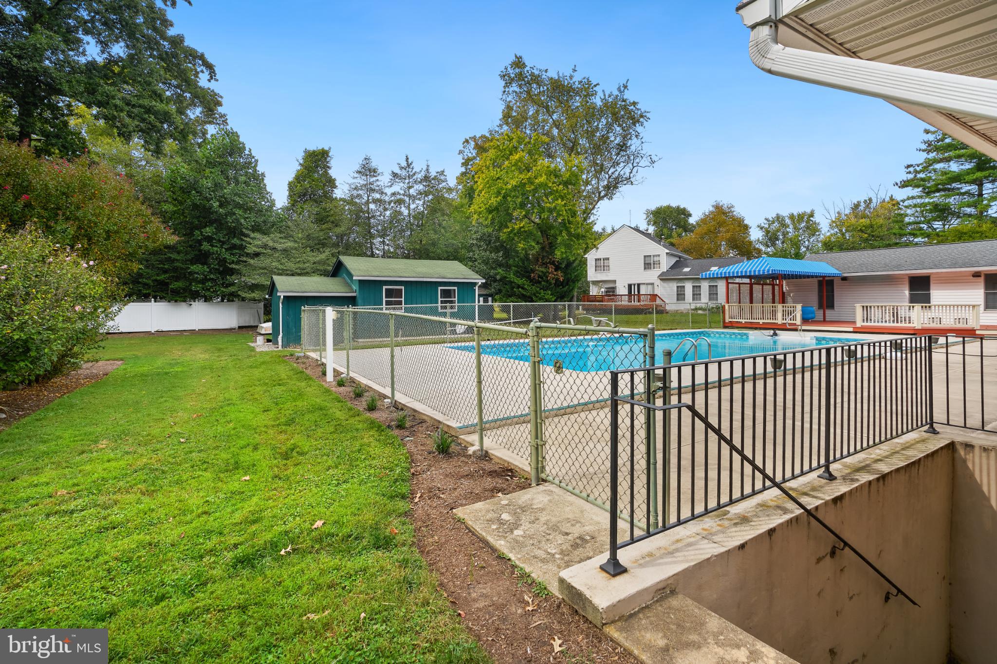 2718 Riva Road Annapolis, MD 21401 - Photo 20 of 25 Serene backyard oasis with pool and greenery.