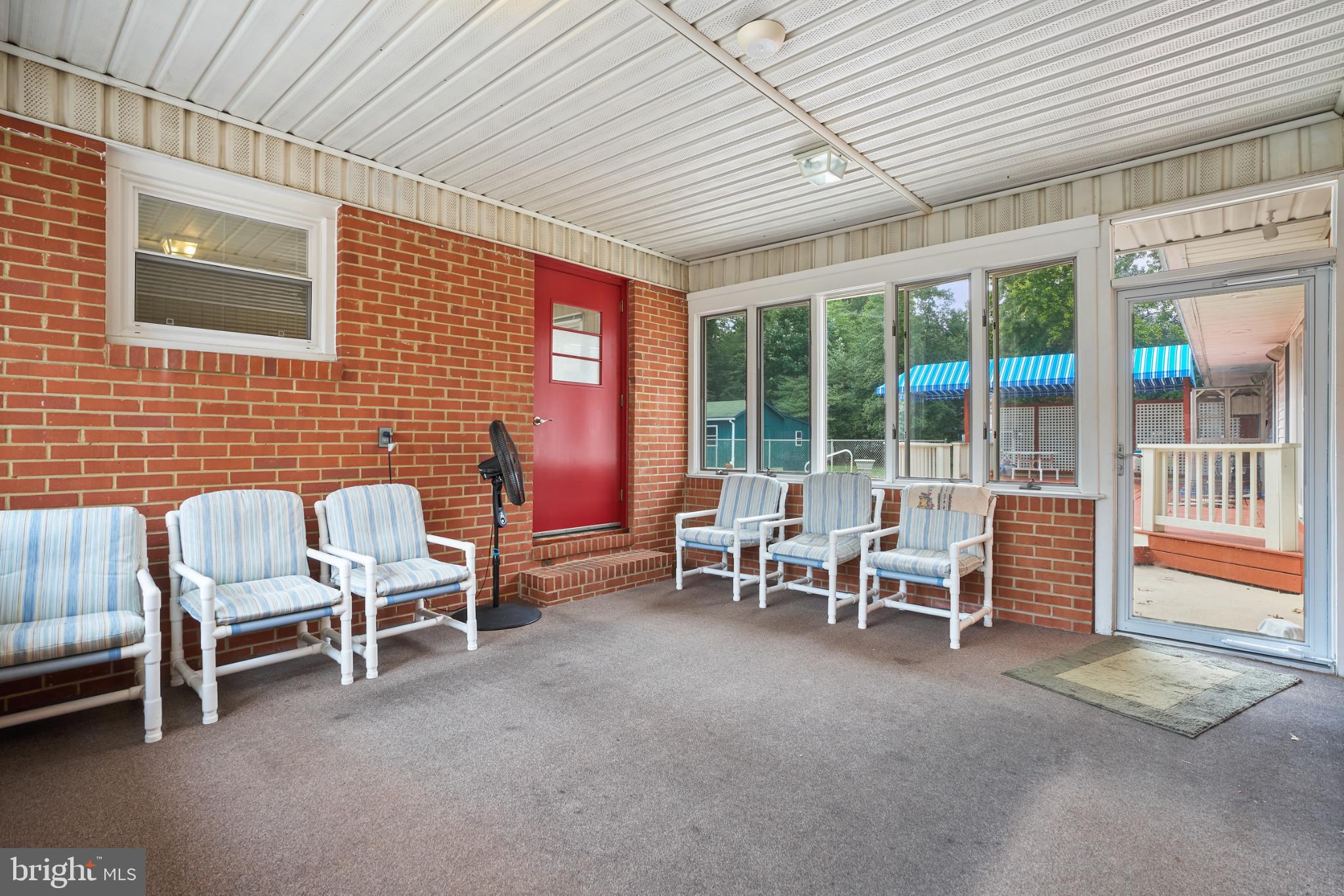 2718 Riva Road Annapolis, MD 21401 - Photo 21 of 25 Inviting sunlit porch with brick accents.