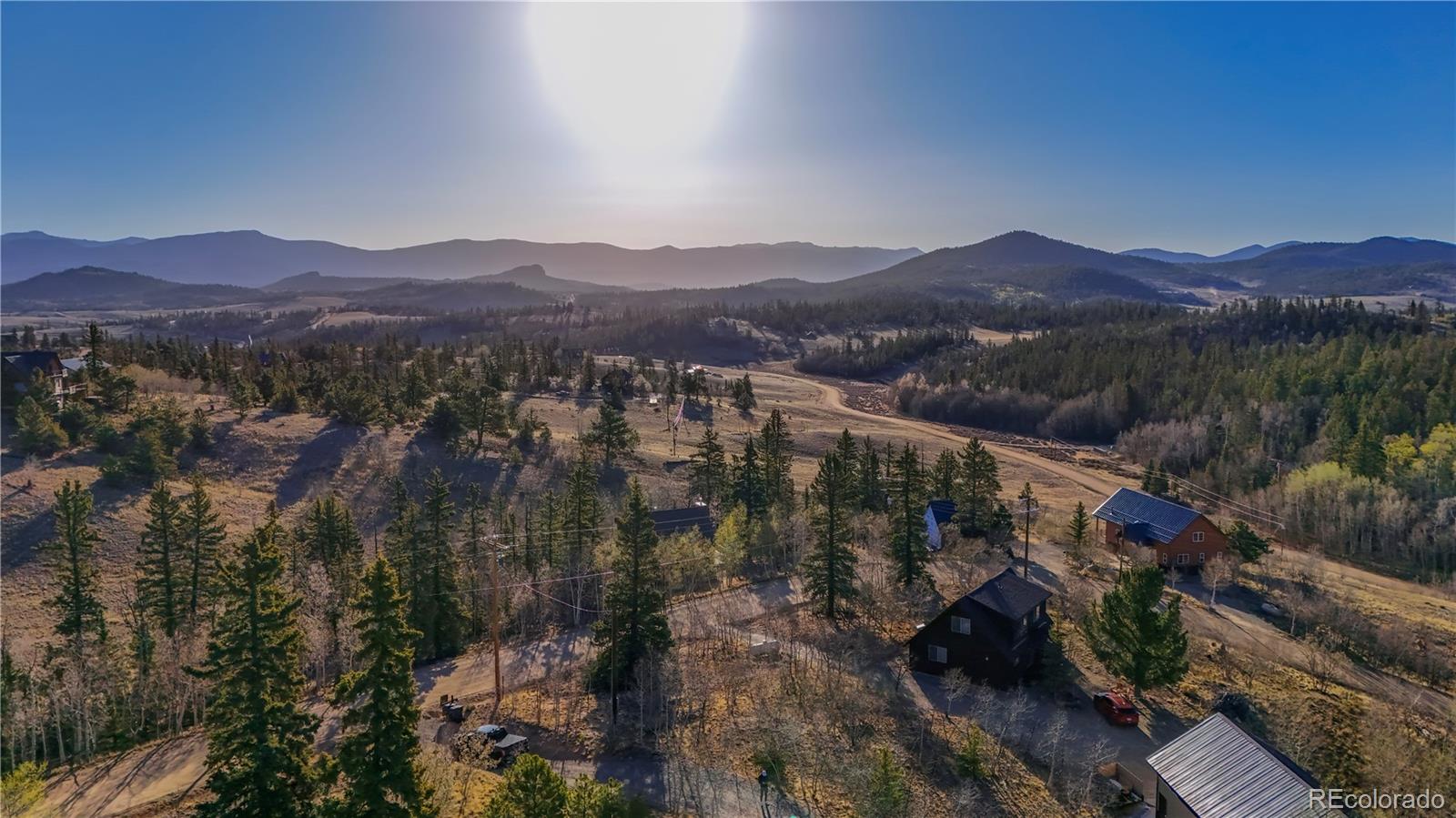 589 Warpath Road Como, CO 80456 - Photo 6 of 28 a view of a lush green hillside and houses