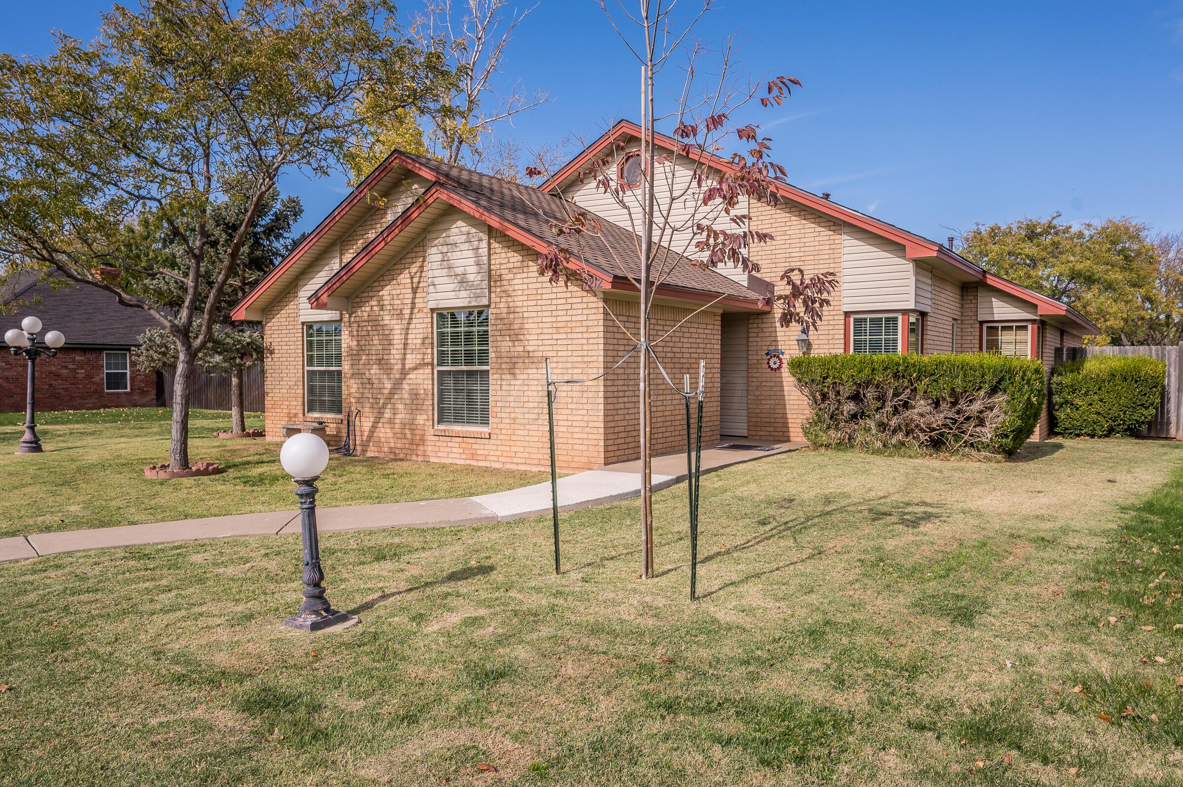 7212 Dukes Place Amarillo, TX 79109 - Photo 1 of 21 a view of a house with a park
