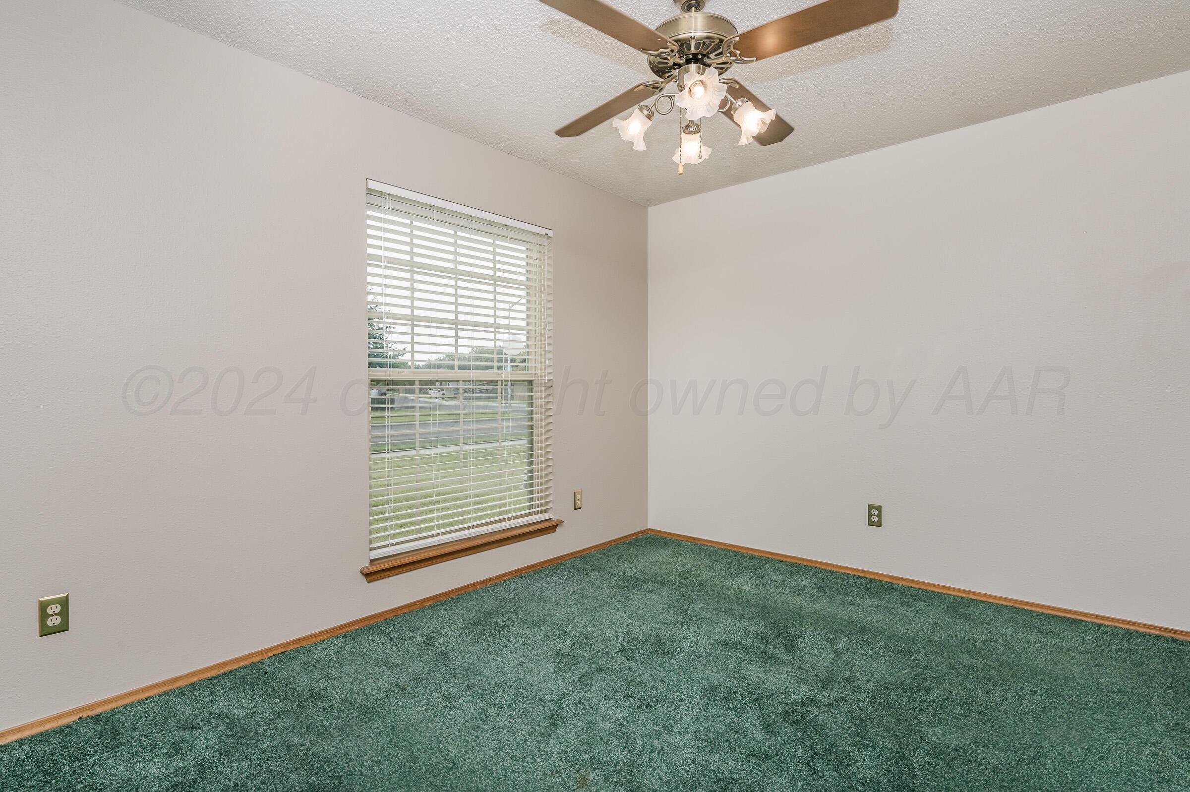 7212 Dukes Place Amarillo, TX 79109 - Photo 16 of 21 an empty room with windows and fan