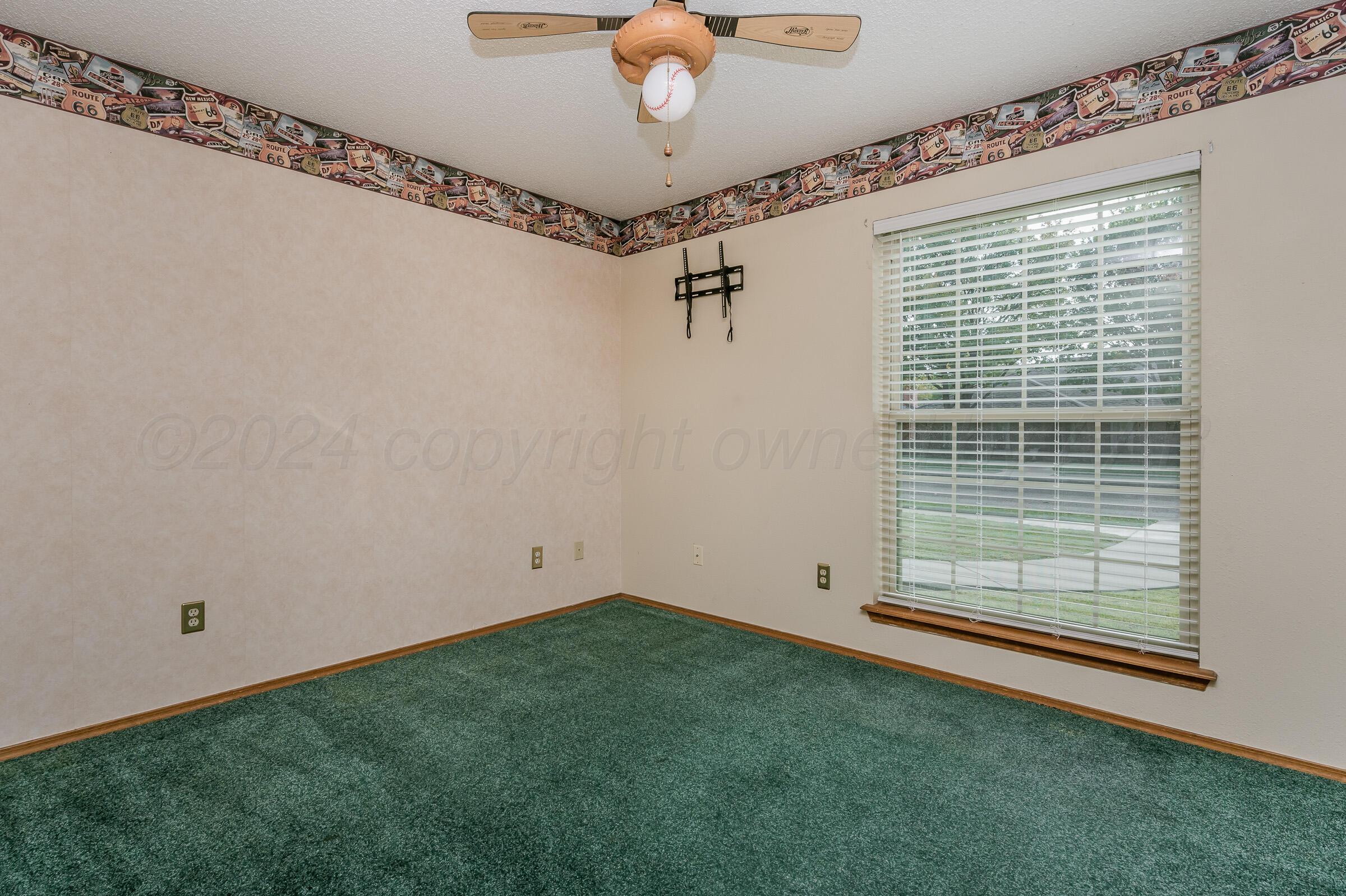 7212 Dukes Place Amarillo, TX 79109 - Photo 17 of 21 a view of a room with window and a ceiling fan
