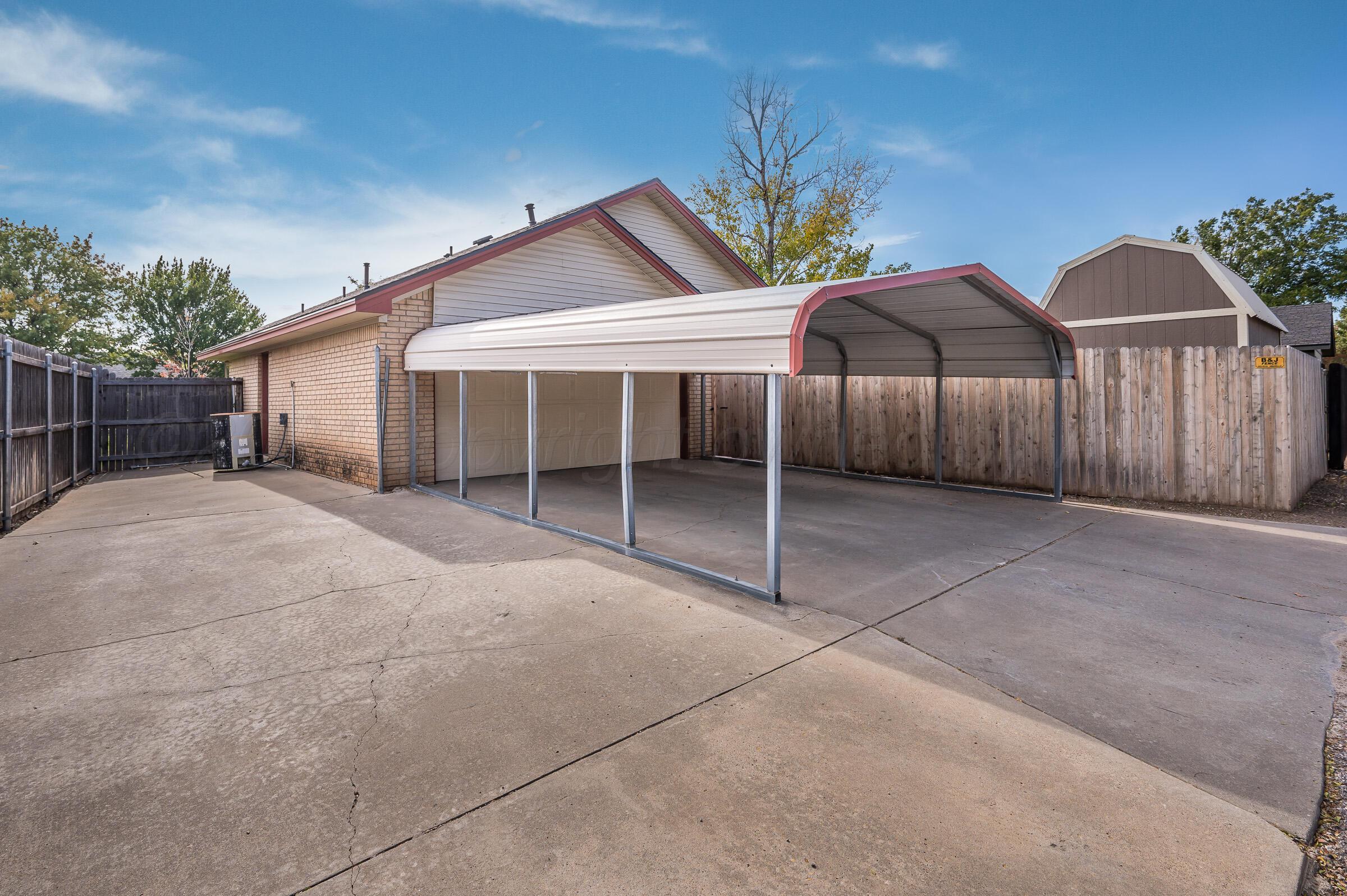 7212 Dukes Place Amarillo, TX 79109 - Photo 21 of 21 a view of a house with a yard and garage