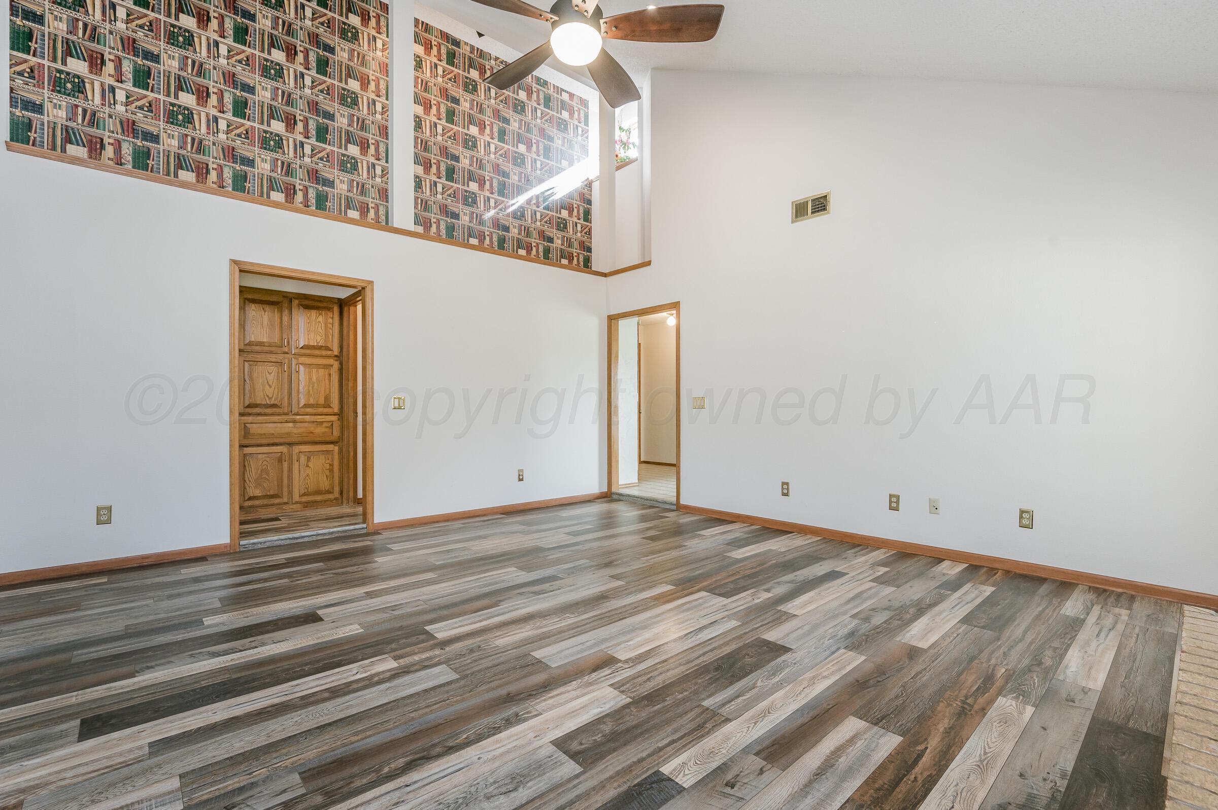 7212 Dukes Place Amarillo, TX 79109 - Photo 5 of 21 a view of empty room with wooden floor