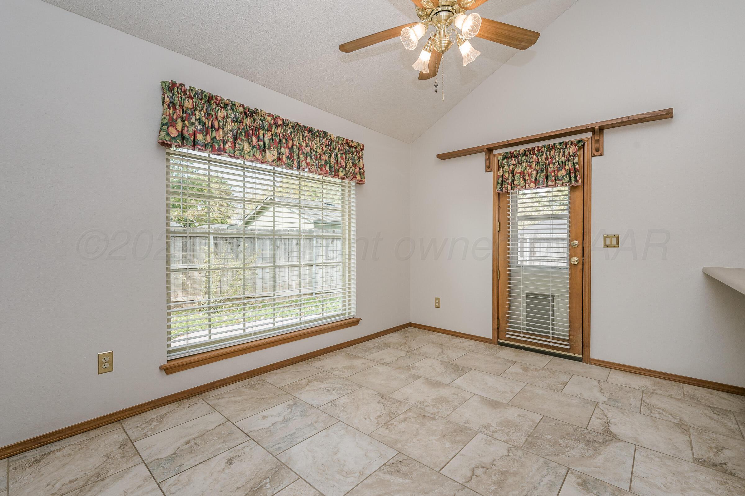 7212 Dukes Place Amarillo, TX 79109 - Photo 6 of 21 a view of an empty room with a window
