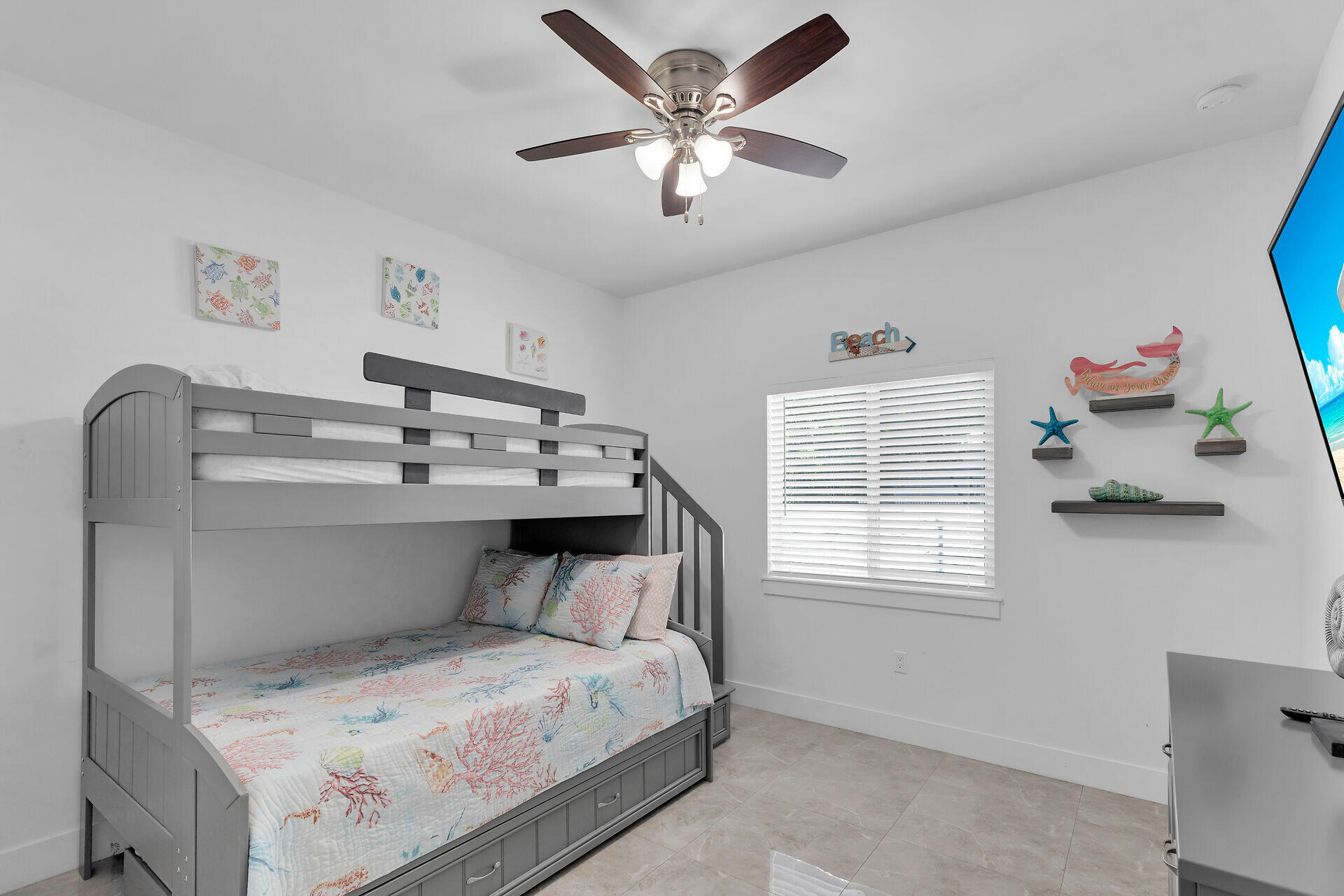 667 Colson Drive Key Largo, FL 33037 - Photo 23 of 48 a bedroom with a bed and a chandelier