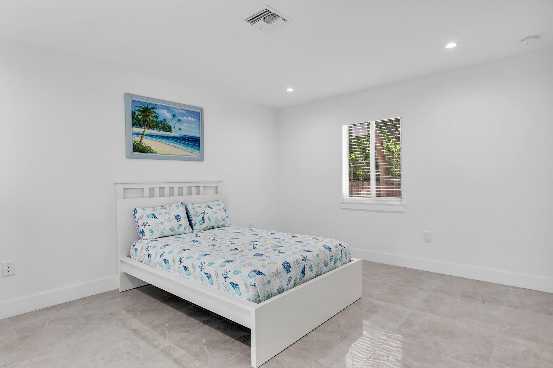 667 Colson Drive Key Largo, FL 33037 - Photo 29 of 48 a bedroom with a bed and a window