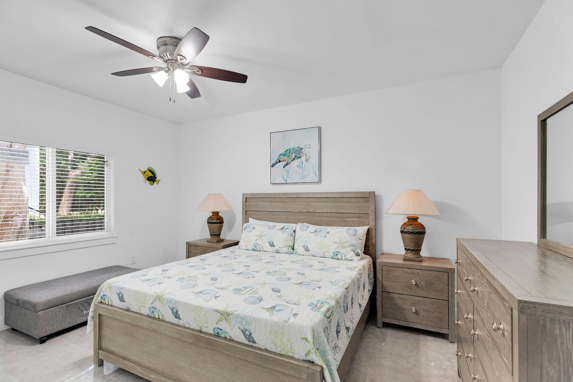 667 Colson Drive Key Largo, FL 33037 - Photo 32 of 48 a bedroom with a bed and a chandelier