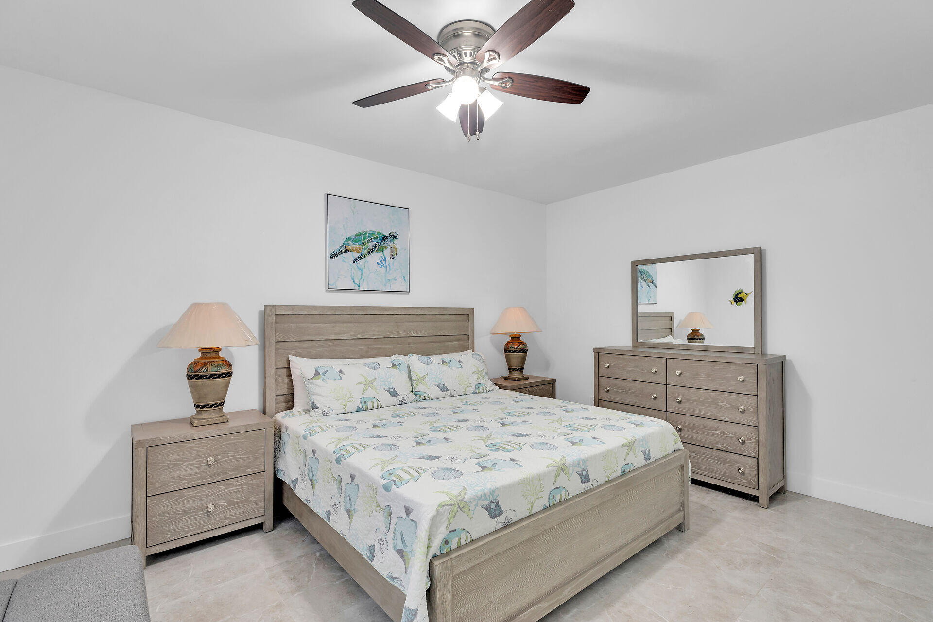 667 Colson Drive Key Largo, FL 33037 - Photo 33 of 48 a bedroom with a bed and a chandelier