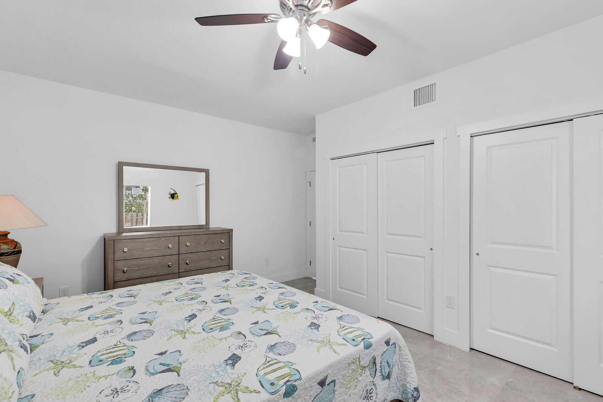 667 Colson Drive Key Largo, FL 33037 - Photo 34 of 48 a bedroom with a bed and a dresser