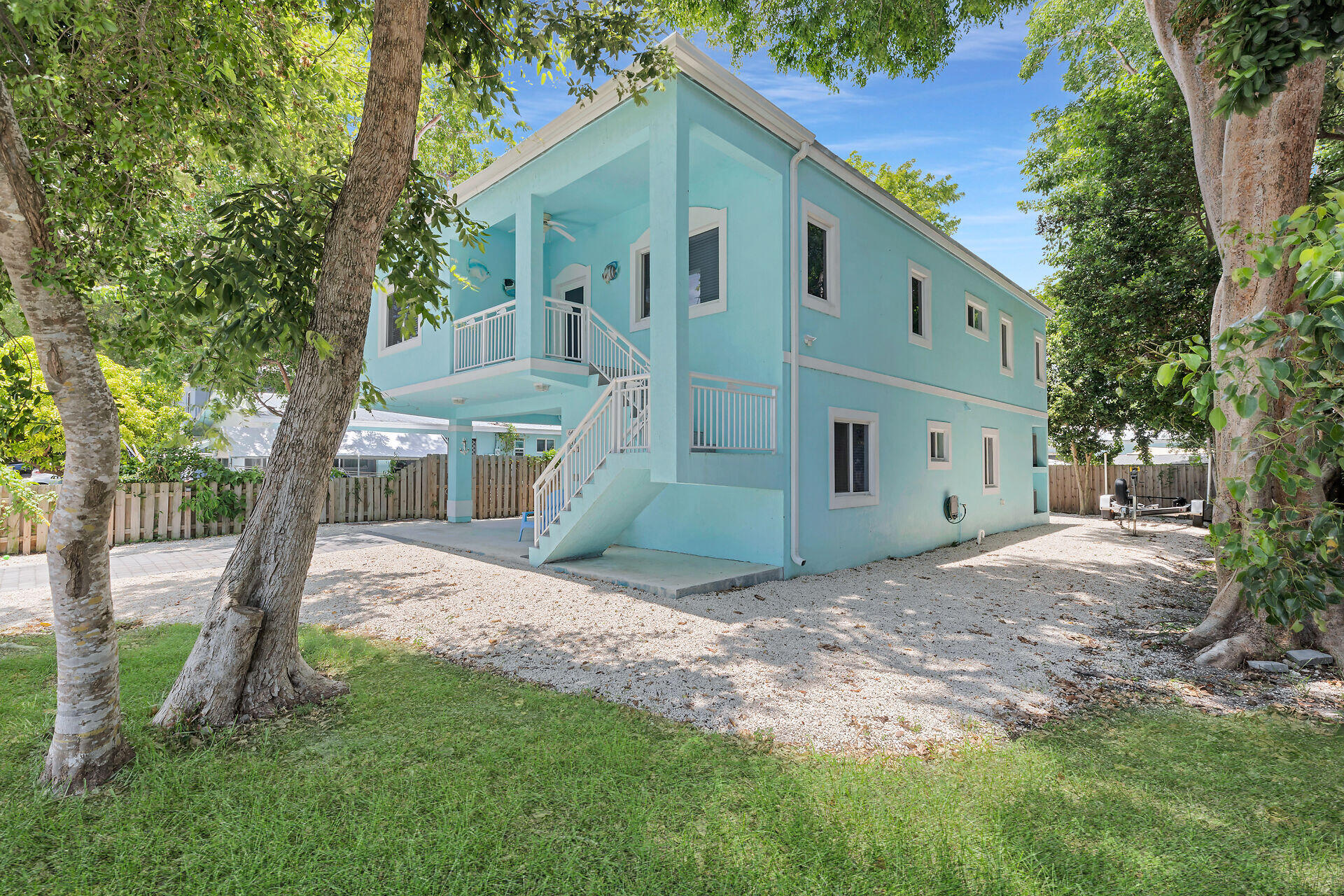 667 Colson Drive Key Largo, FL 33037 - Photo 36 of 48 a view of a house with backyard and a tree