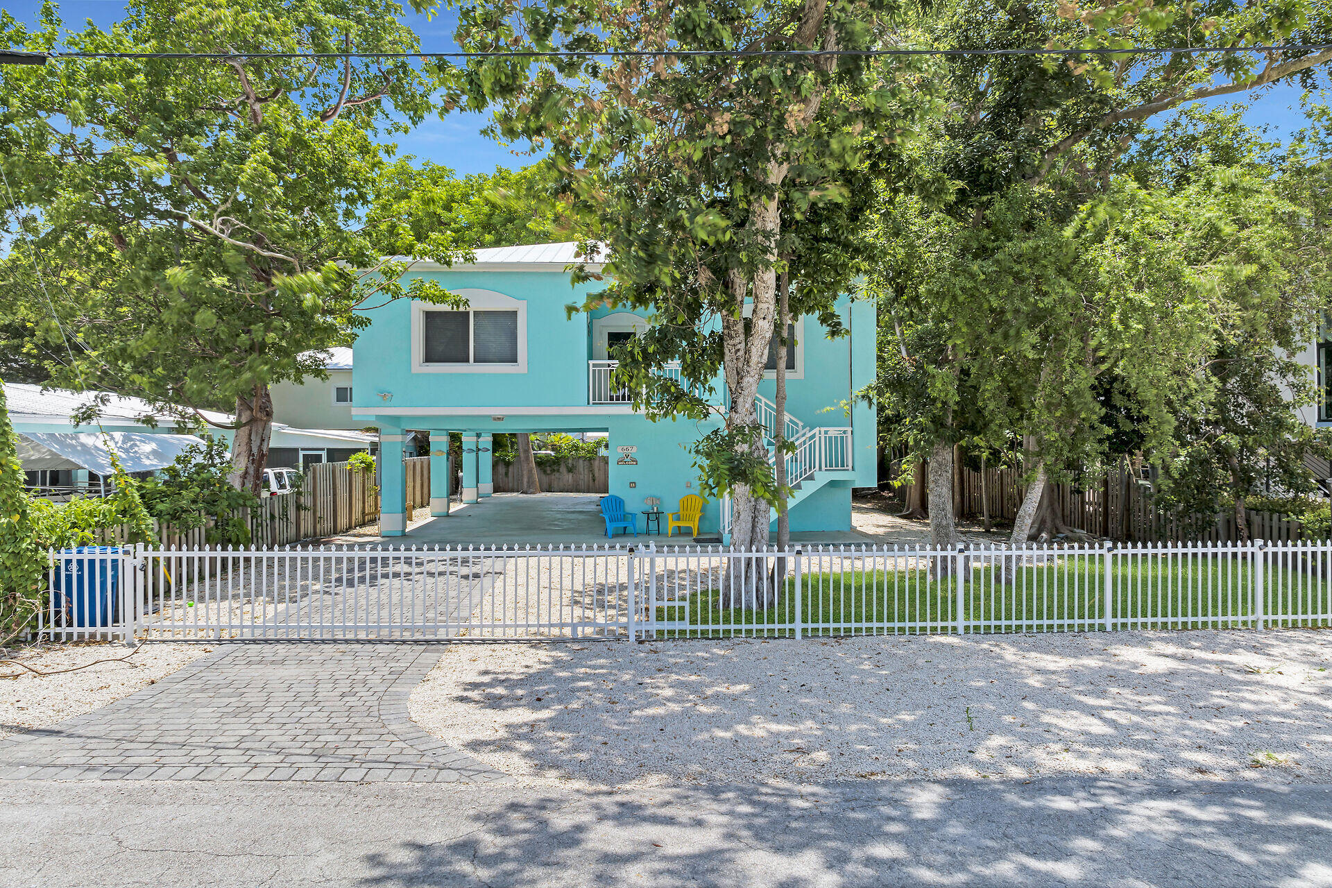 667 Colson Drive Key Largo, FL 33037 - Photo 46 of 48 a view of a house with a yard and large tree