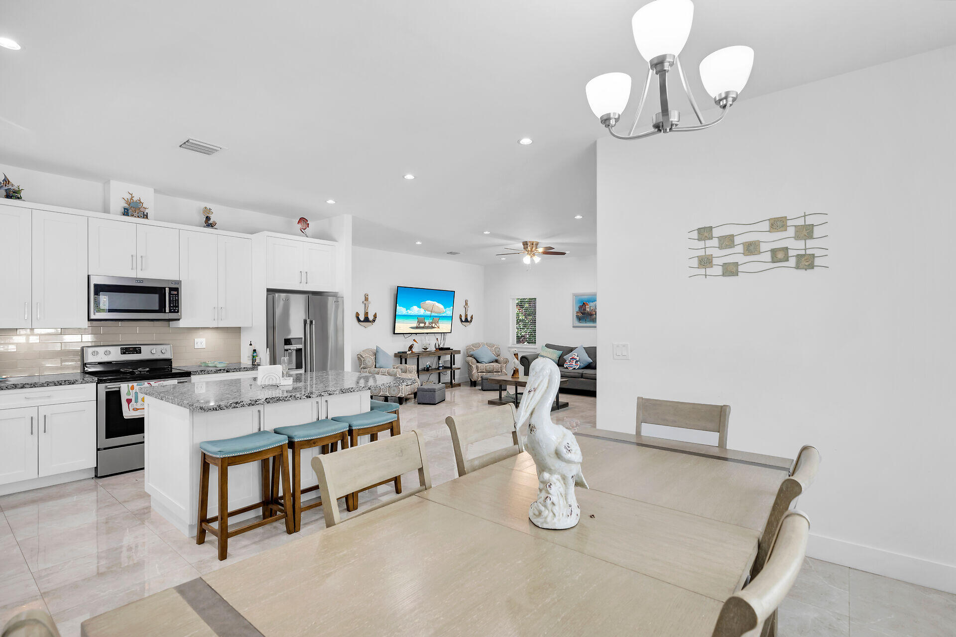 667 Colson Drive Key Largo, FL 33037 - Photo 8 of 48 a large kitchen with a table and chairs