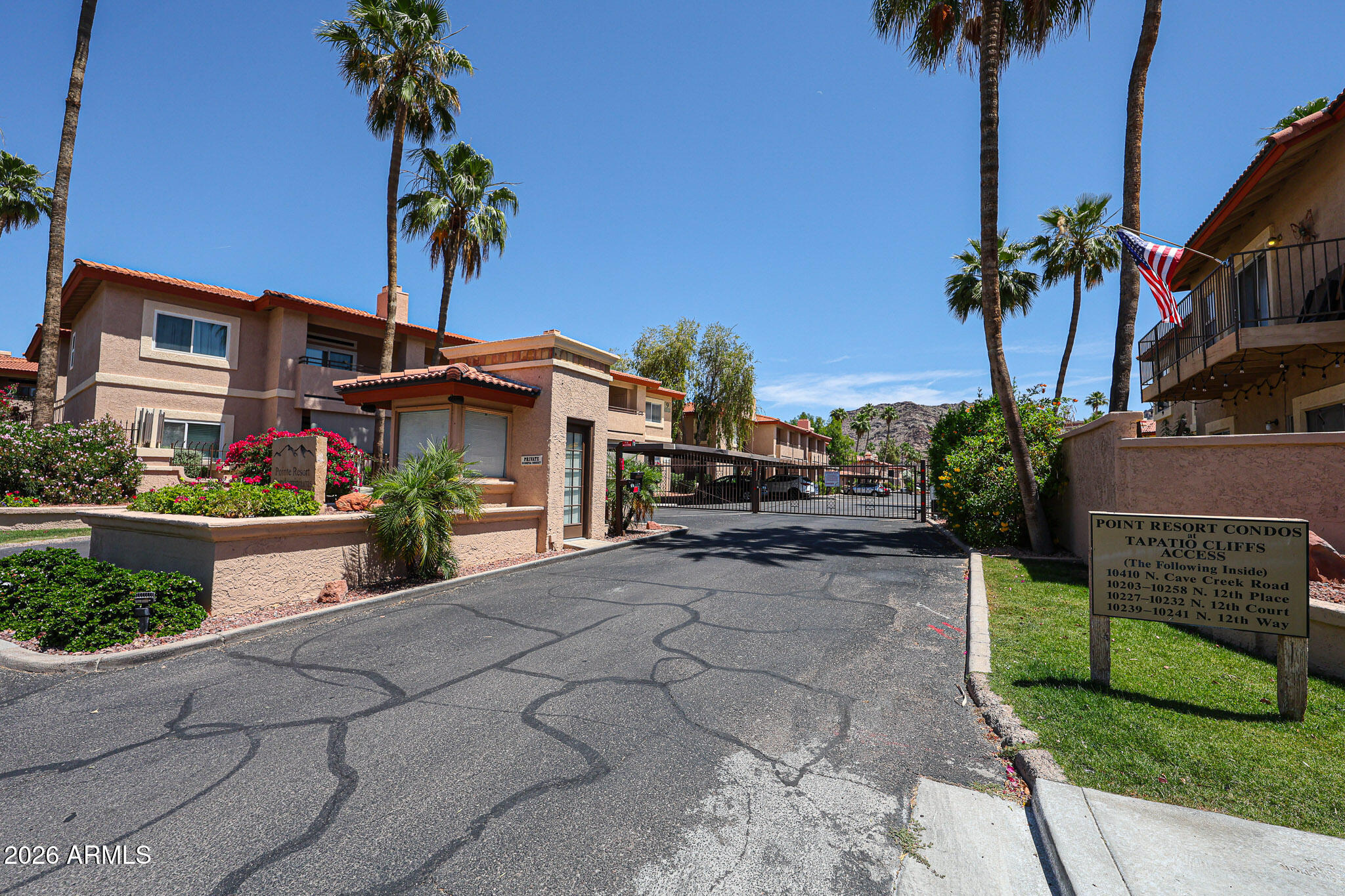 10410 North Cave Creek Road, Unit 1011 Phoenix, AZ 85020 - Photo 54 of 54 a view of a house with a yard and potted plants