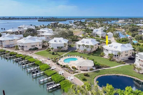 an aerial view of residential houses with outdoor space
